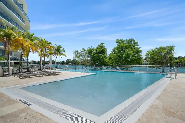 a view of swimming pool with a lake view