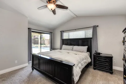 a bedroom with a bed dresser and a window