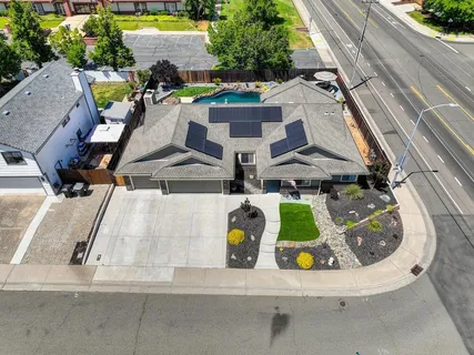 an aerial view of residential houses with outdoor space