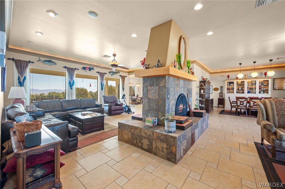 5840 North Cedar Ridge Lane Kingman, AZ 86409 - Photo 14 of 89 a living room with fireplace furniture and a fireplace