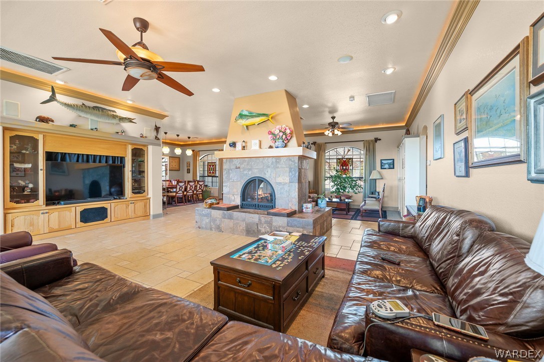 5840 North Cedar Ridge Lane Kingman, AZ 86409 - Photo 15 of 89 a living room with furniture and a fireplace