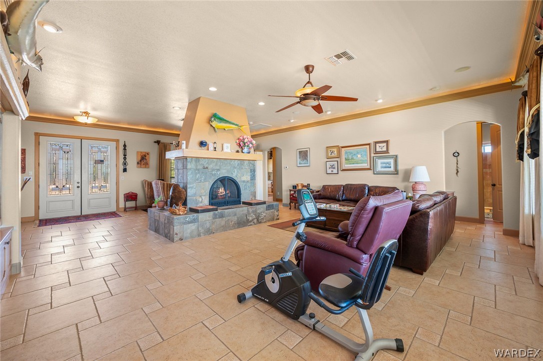 5840 North Cedar Ridge Lane Kingman, AZ 86409 - Photo 16 of 89 a living room with furniture a chandelier and a dining room
