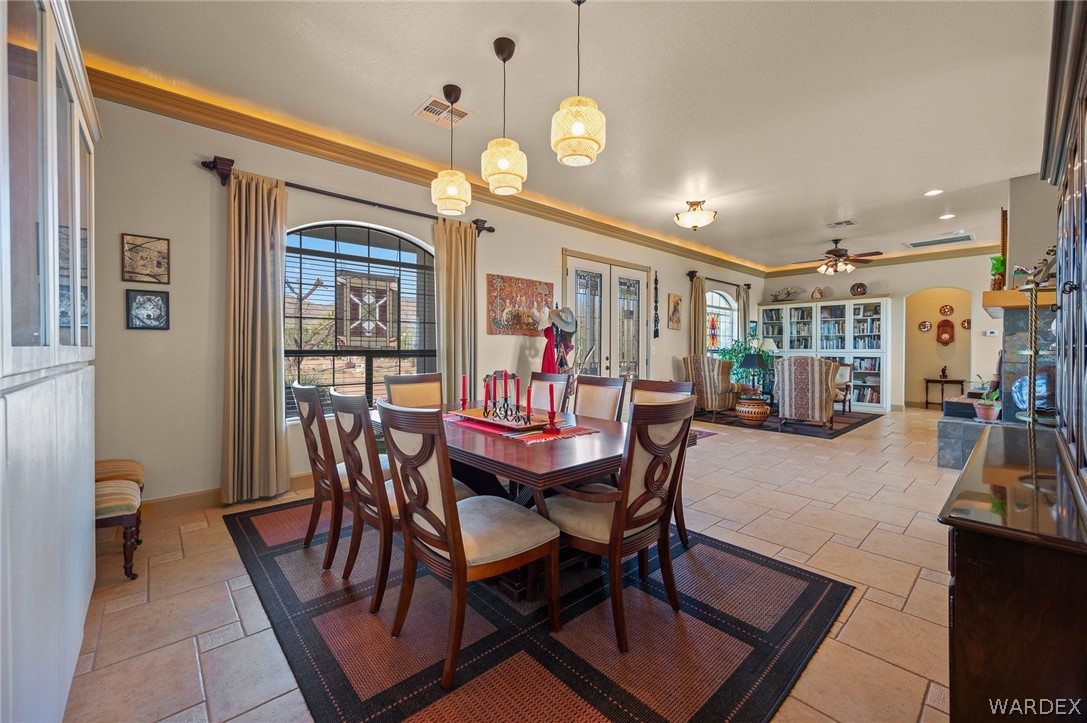 5840 North Cedar Ridge Lane Kingman, AZ 86409 - Photo 17 of 89 a dining room with furniture and window