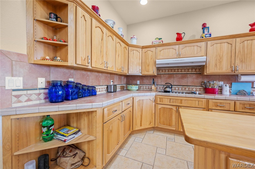 5840 North Cedar Ridge Lane Kingman, AZ 86409 - Photo 23 of 89 a kitchen with stainless steel appliances granite countertop a sink dishwasher and cabinets with wooden floor