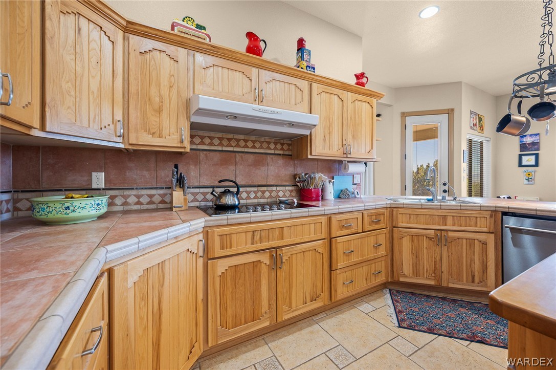5840 North Cedar Ridge Lane Kingman, AZ 86409 - Photo 24 of 89 a kitchen with stainless steel appliances granite countertop a sink and cabinets