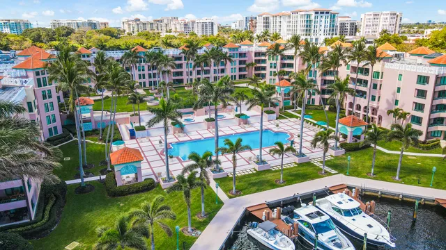 a kitchen with stainless steel appliances granite countertop white cabinets a microwave oven and a sink