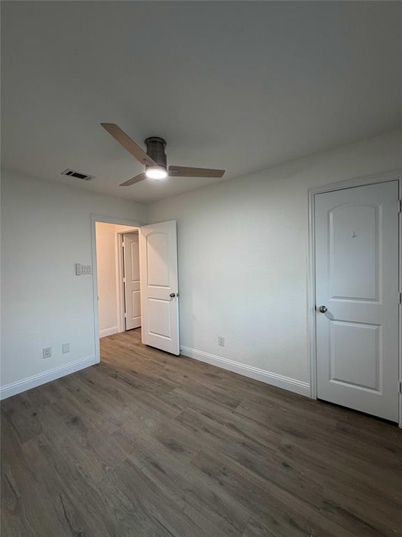 5020 Timber Creek Road Flower Mound, TX 75028 - Photo 12 of 15 a view of an empty room with wooden floor