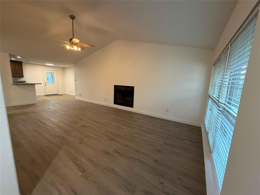 5020 Timber Creek Road Flower Mound, TX 75028 - Photo 2 of 15 wooden floor in an empty room with a window