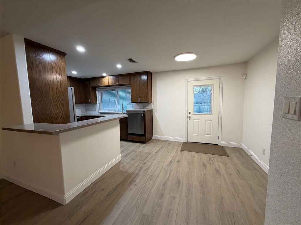 5020 Timber Creek Road Flower Mound, TX 75028 - Photo 3 of 15 a view of kitchen with wooden floor