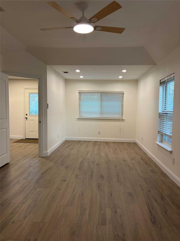 5020 Timber Creek Road Flower Mound, TX 75028 - Photo 6 of 15 an empty room with wooden floor and windows