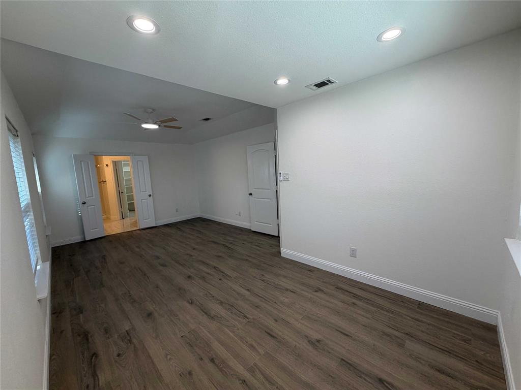 5020 Timber Creek Road Flower Mound, TX 75028 - Photo 7 of 15 an empty room with wooden floor and window