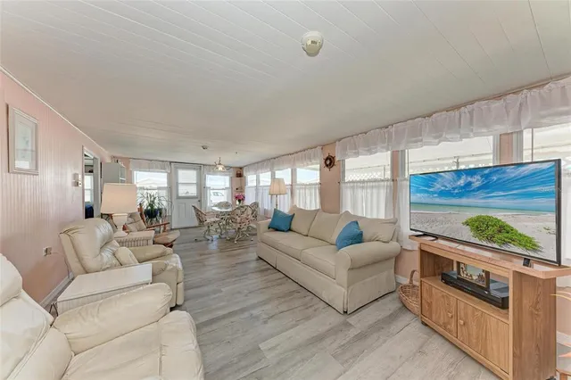 a kitchen that has a lot of cabinets in it and appliances