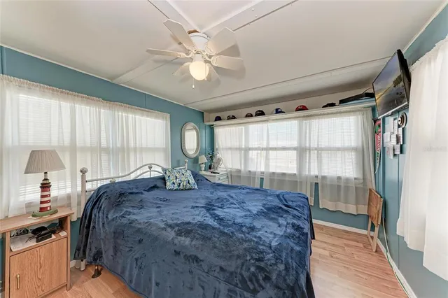 a bedroom with a bed dresser and a window