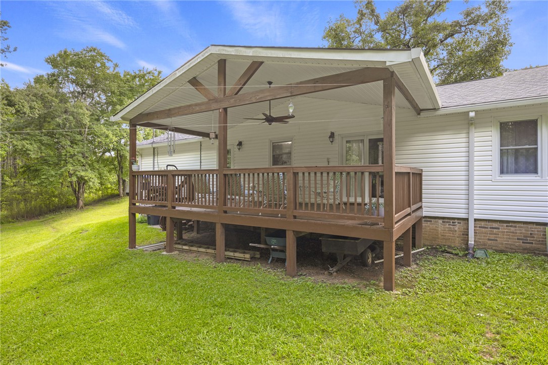 250 Rockcrest Road Cleveland, SC 29635 - Photo 30 of 37 Relax and entertain on this generous covered deck overlooking a verdant lawn.