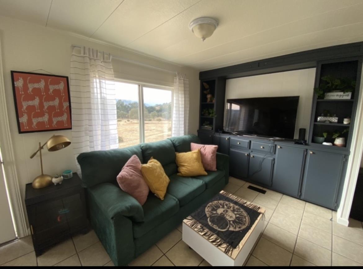 9220 Burchell Road Gilroy, CA 95020 - Photo 8 of 26 a living room with furniture and a flat screen tv