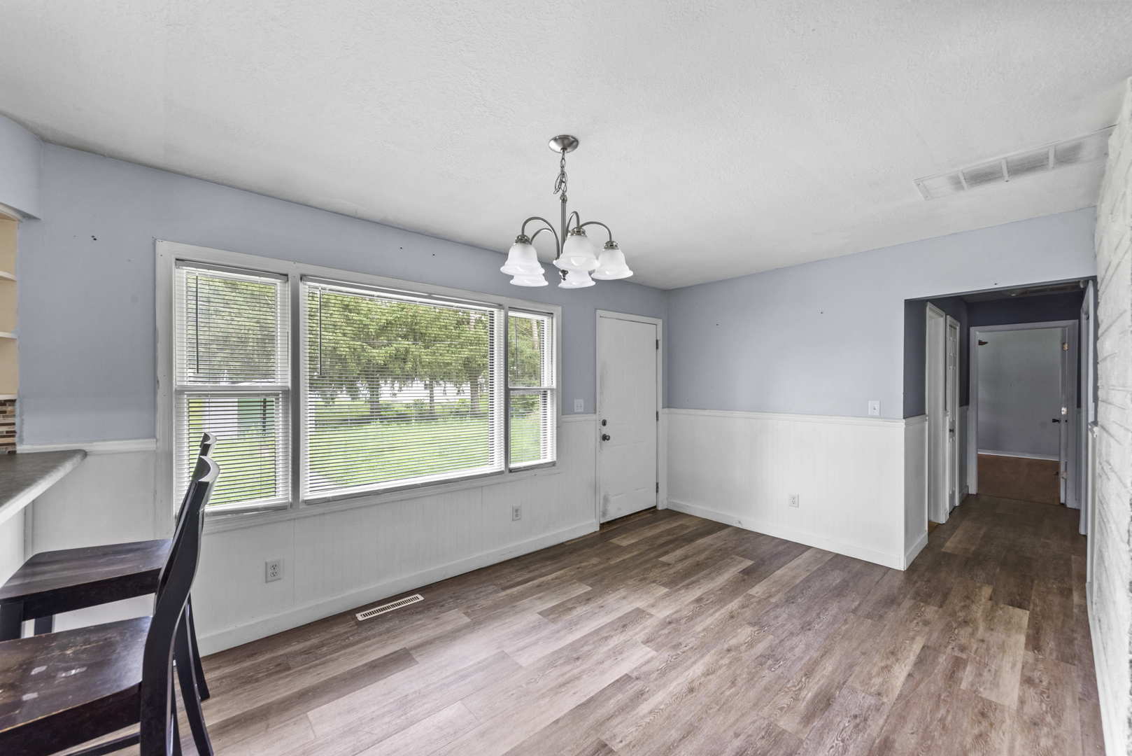 2 Baker Street Kankakee, IL 60901 - Photo 11 of 17 a view of empty room with wooden floor and fan