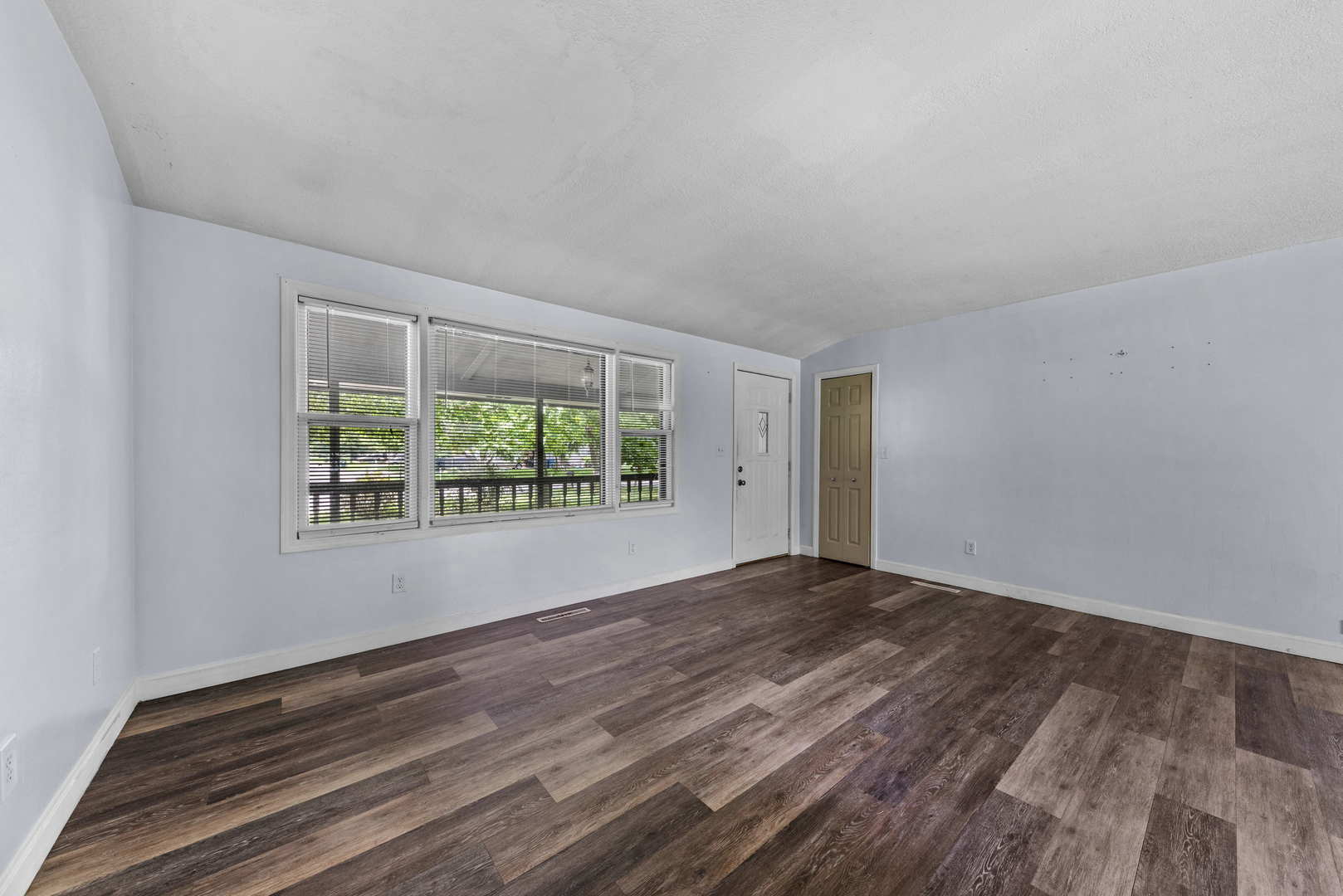 2 Baker Street Kankakee, IL 60901 - Photo 6 of 17 wooden floor in an empty room with a window