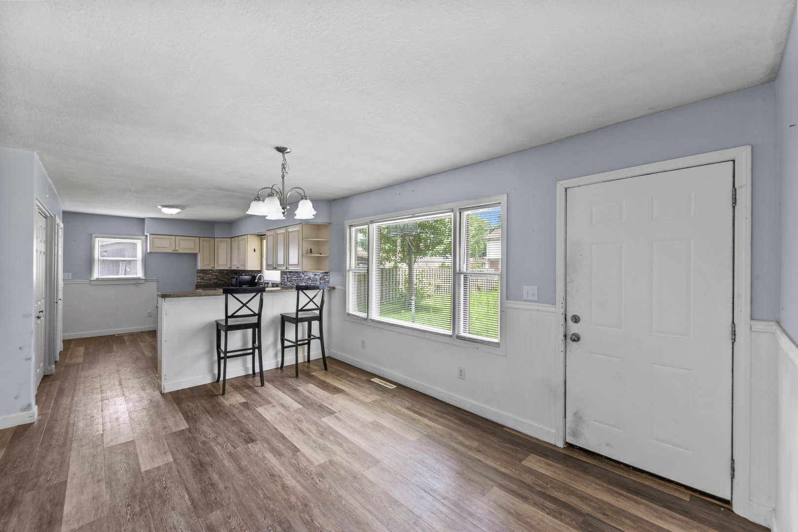 2 Baker Street Kankakee, IL 60901 - Photo 8 of 17 a view of a livingroom with furniture window and wooden floor