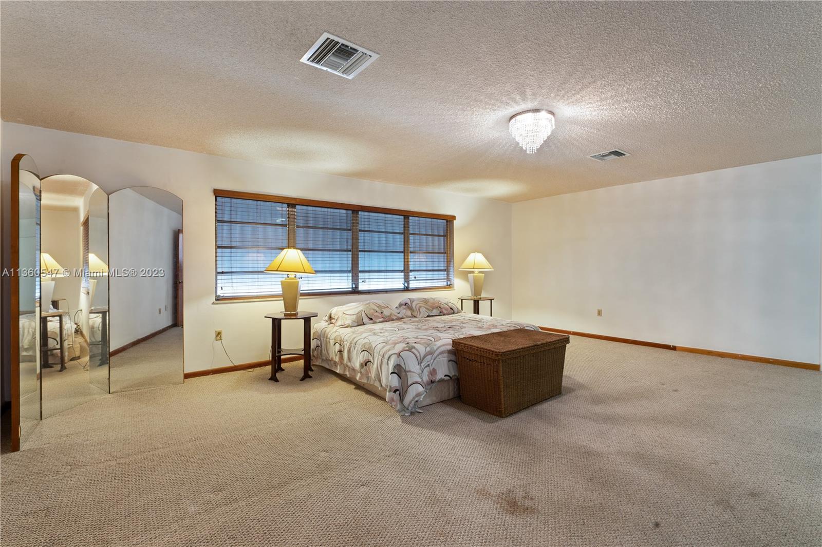 30 Southwest 21st Road Miami, FL 33129 - Photo 19 of 30 a bed room with a bed and a lamp