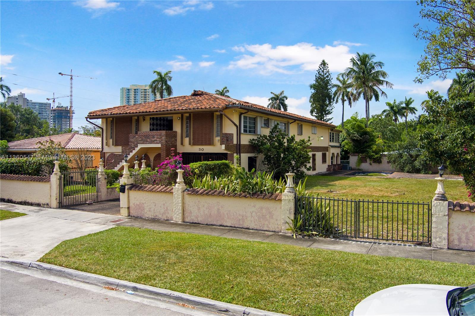 30 Southwest 21st Road Miami, FL 33129 - Photo 25 of 30 a view of a house with a yard porch and sitting area