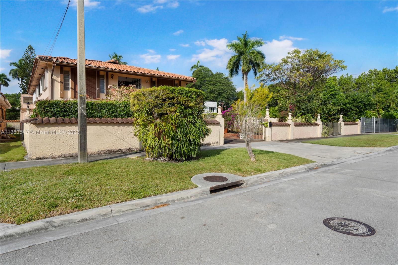 30 Southwest 21st Road Miami, FL 33129 - Photo 30 of 30 a view of a house with a yard and potted plants