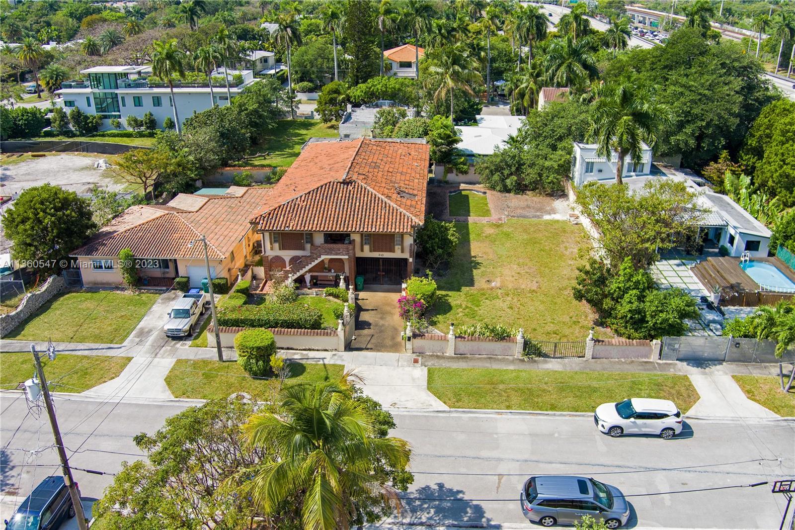 30 Southwest 21st Road Miami, FL 33129 - Photo 5 of 30 an aerial view of a house with swimming pool outdoor seating and yard