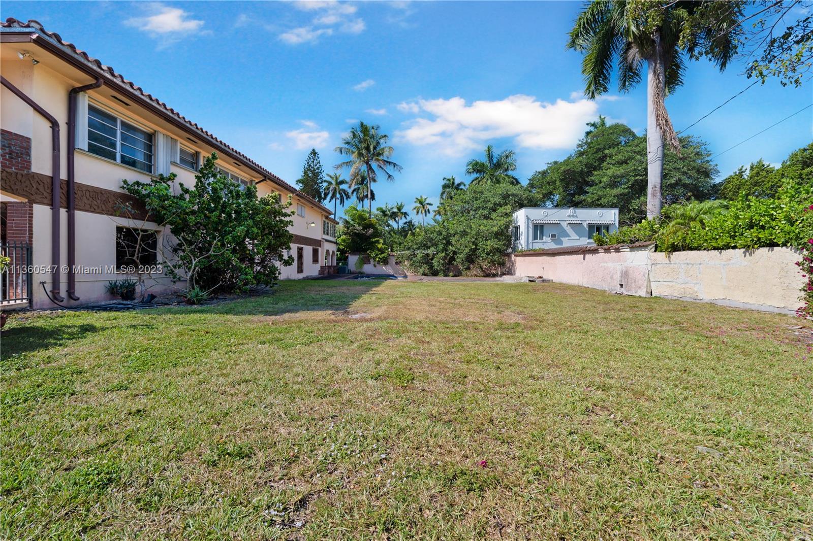 30 Southwest 21st Road Miami, FL 33129 - Photo 7 of 30 a view of a house with a yard and a garage