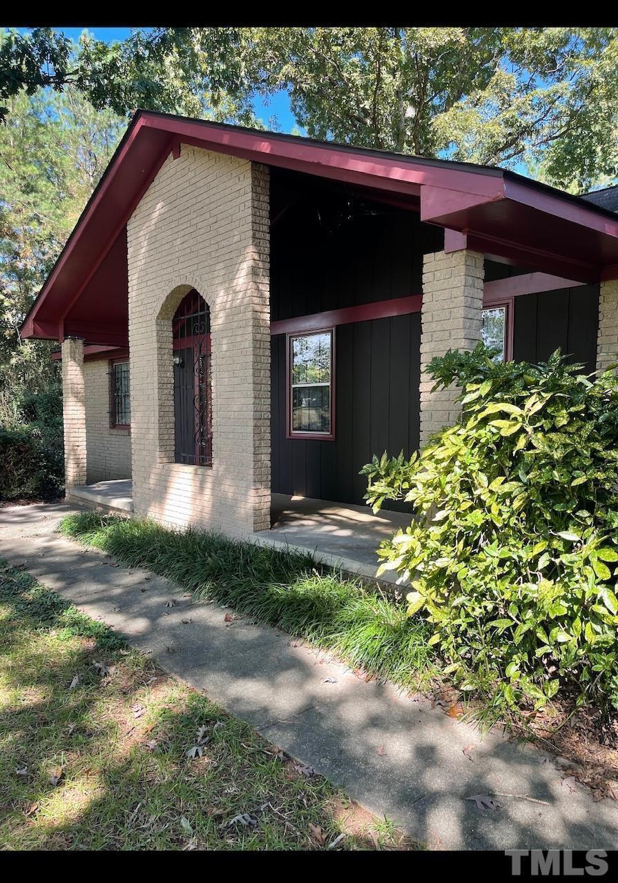 9004 Litchford Road Raleigh, NC 27615 - Photo 1 of 4 a front view of a house with a yard