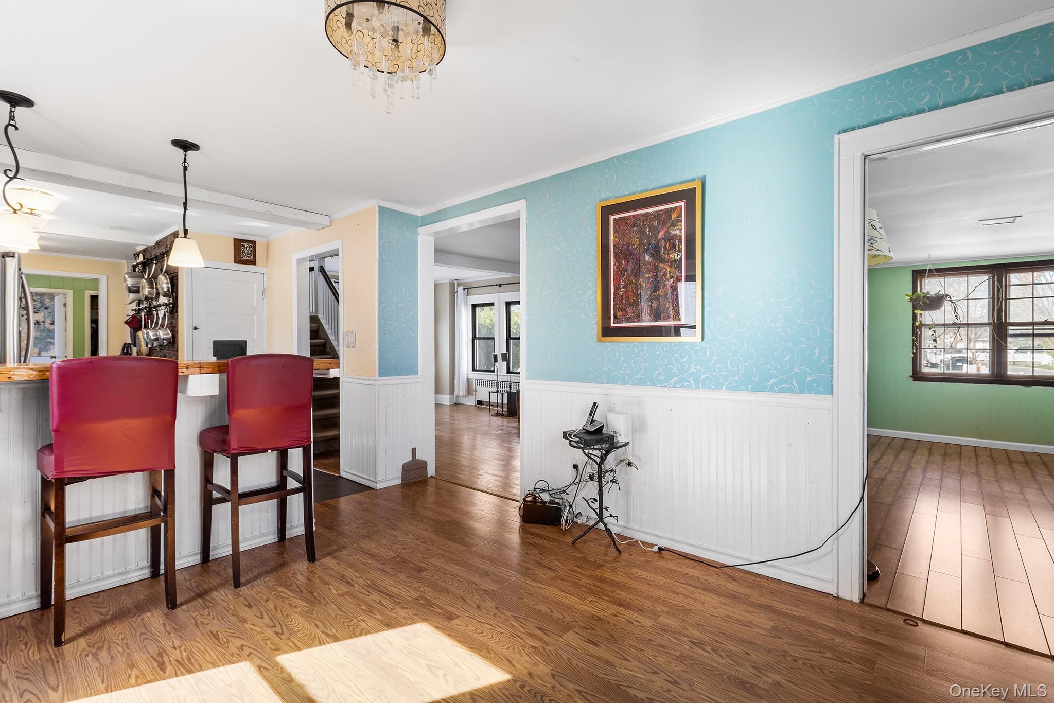 42 Robertson Road Lynbrook, NY 11563 - Photo 12 of 23 a view of a livingroom with furniture a dining table and chairs