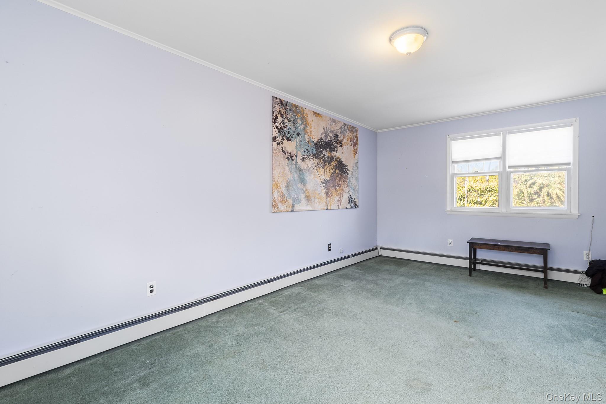 42 Robertson Road Lynbrook, NY 11563 - Photo 13 of 23 an empty room with windows