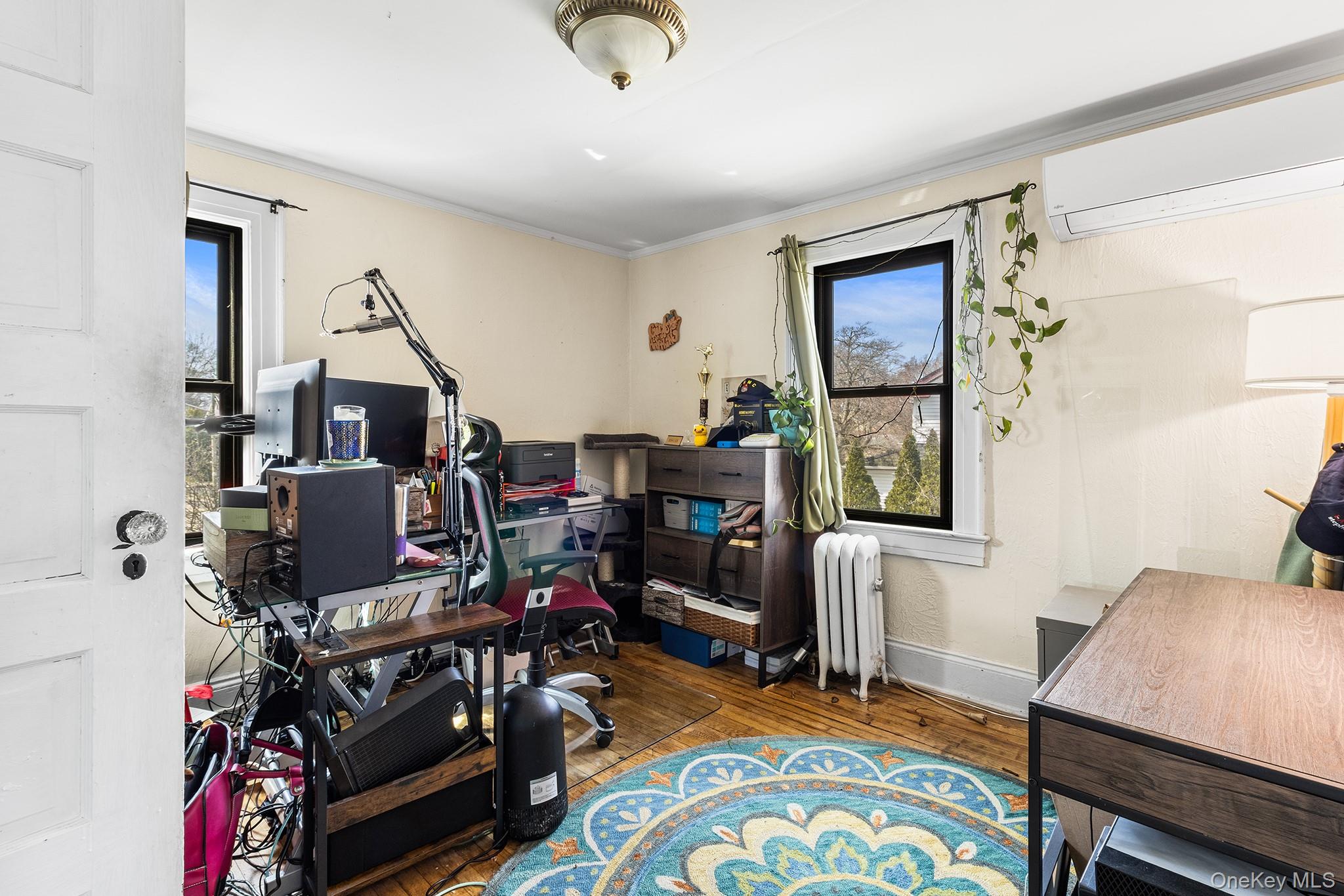 42 Robertson Road Lynbrook, NY 11563 - Photo 16 of 23 a view of a workspace with furniture and a window
