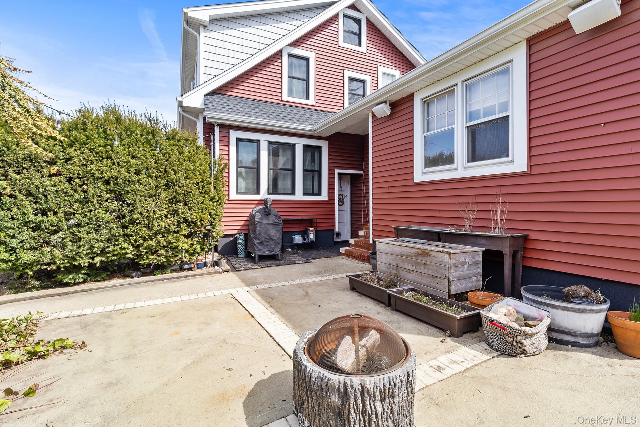 42 Robertson Road Lynbrook, NY 11563 - Photo 21 of 23 a front view of a house with chairs