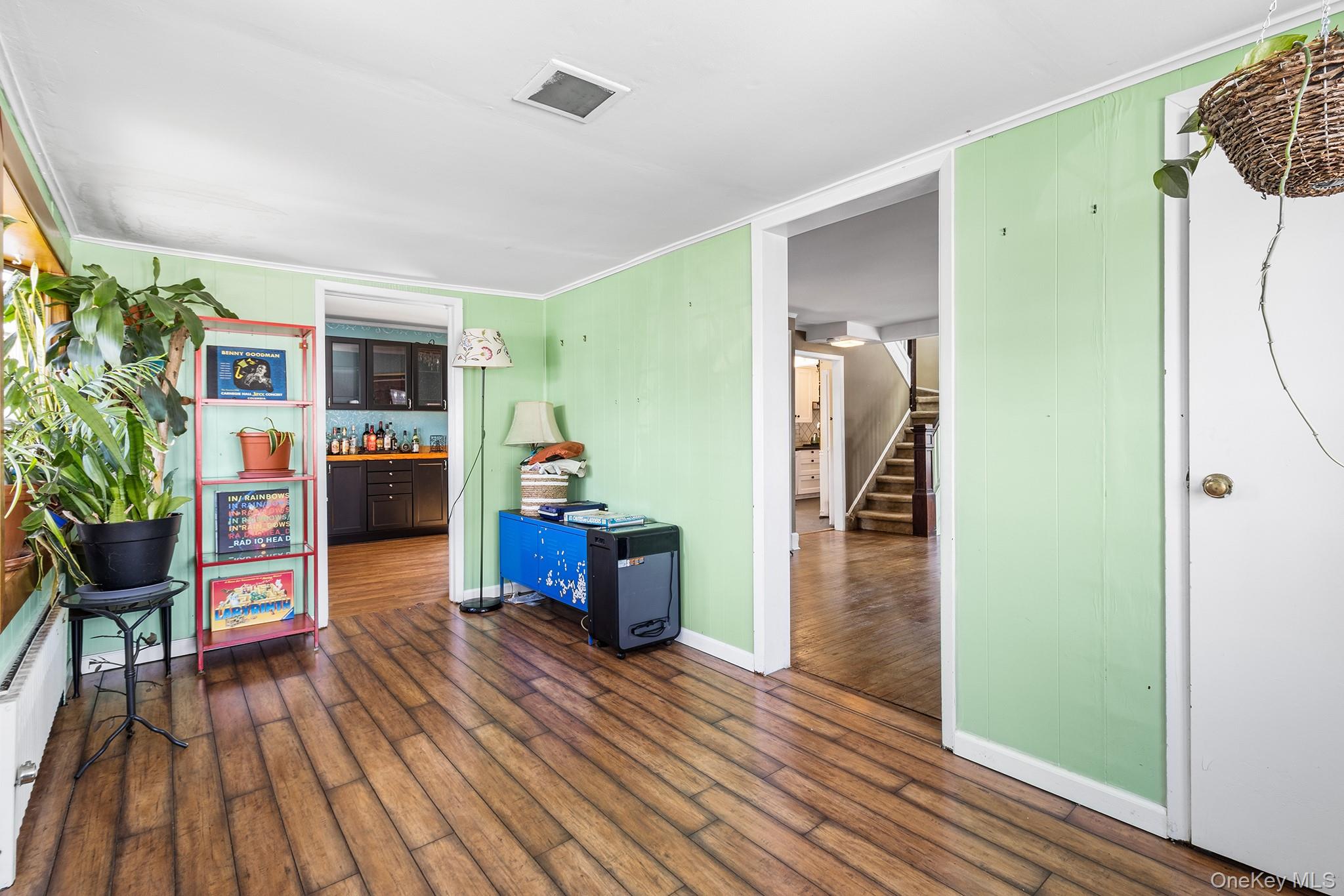 42 Robertson Road Lynbrook, NY 11563 - Photo 3 of 23 a living room with furniture and a wooden floor