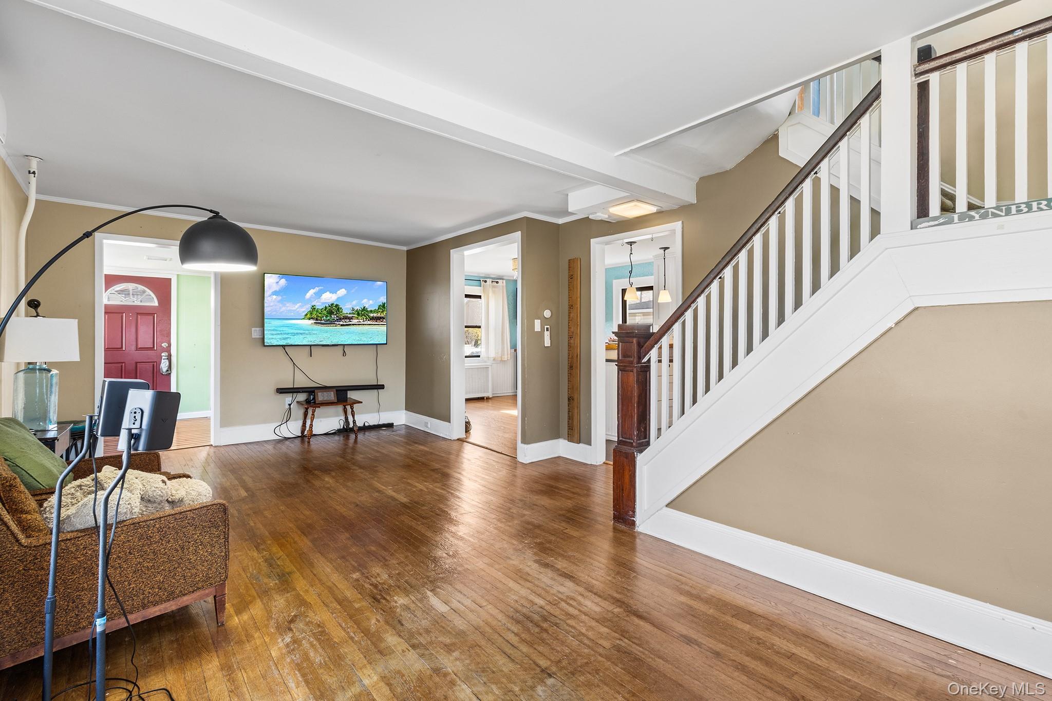 42 Robertson Road Lynbrook, NY 11563 - Photo 6 of 23 a living room with furniture and a flat screen tv