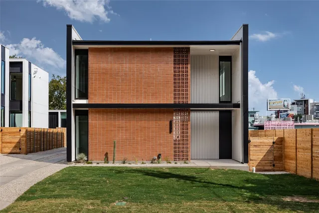 a front view of a house with yard
