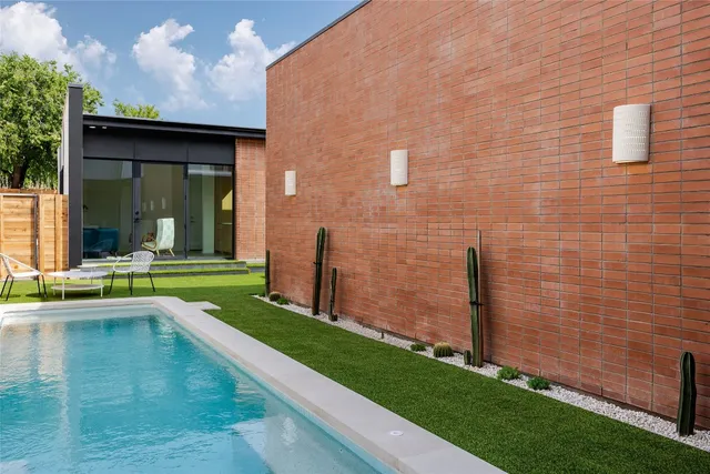 a view of swimming pool with a yard