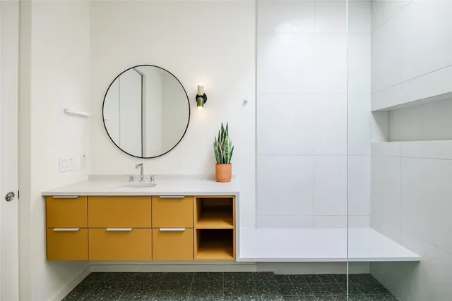 a bathroom with a sink a mirror and a bathtub