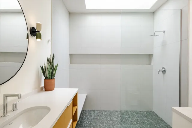 a bathroom with a sink and a mirror