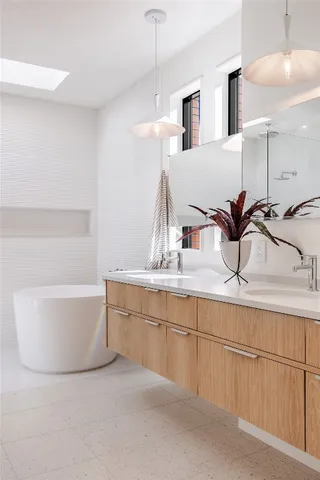a bathroom with a sink and mirror