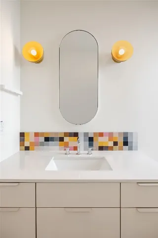 a bathroom with a sink and a mirror