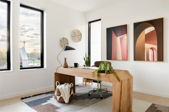 a view of a dining room with furniture and a window