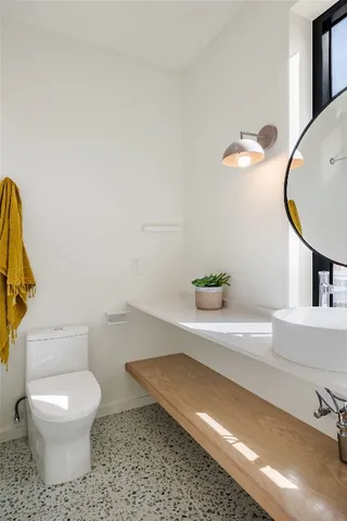 a bathroom with a toilet and a sink