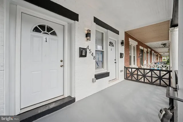a view of a hallway with entryway door