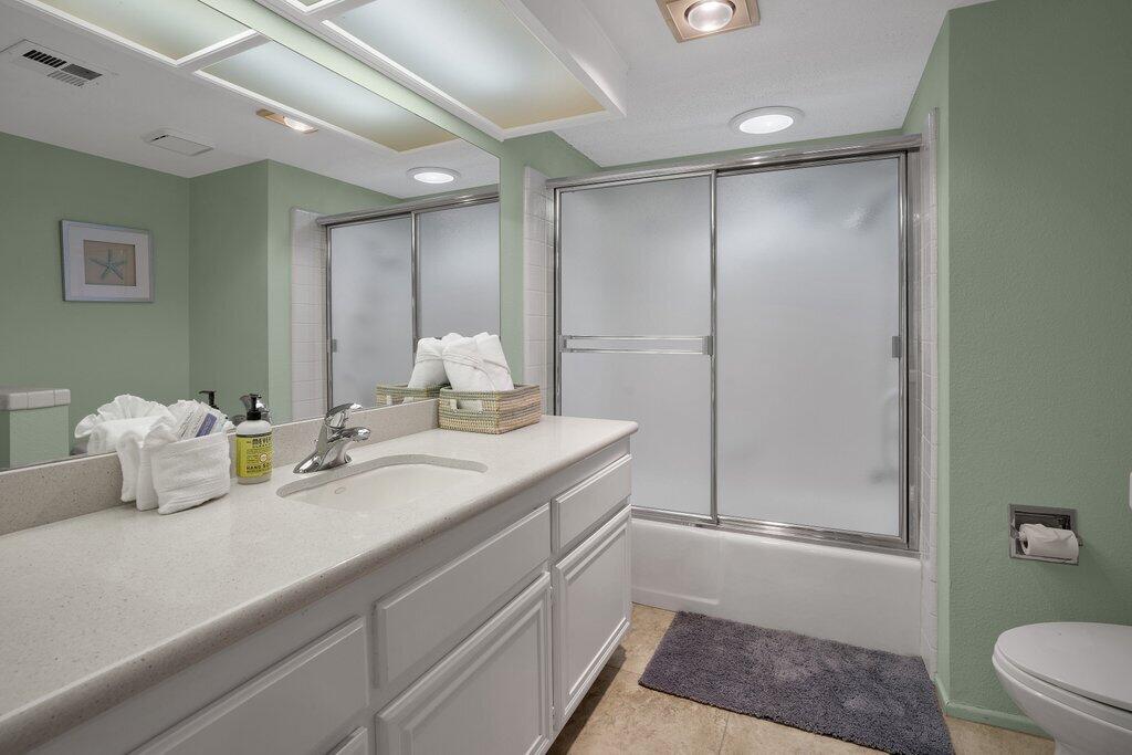 41071 Preston Trail Palm Desert, CA 92211 - Photo 12 of 29 a bathroom with a granite countertop sink a toilet and shower