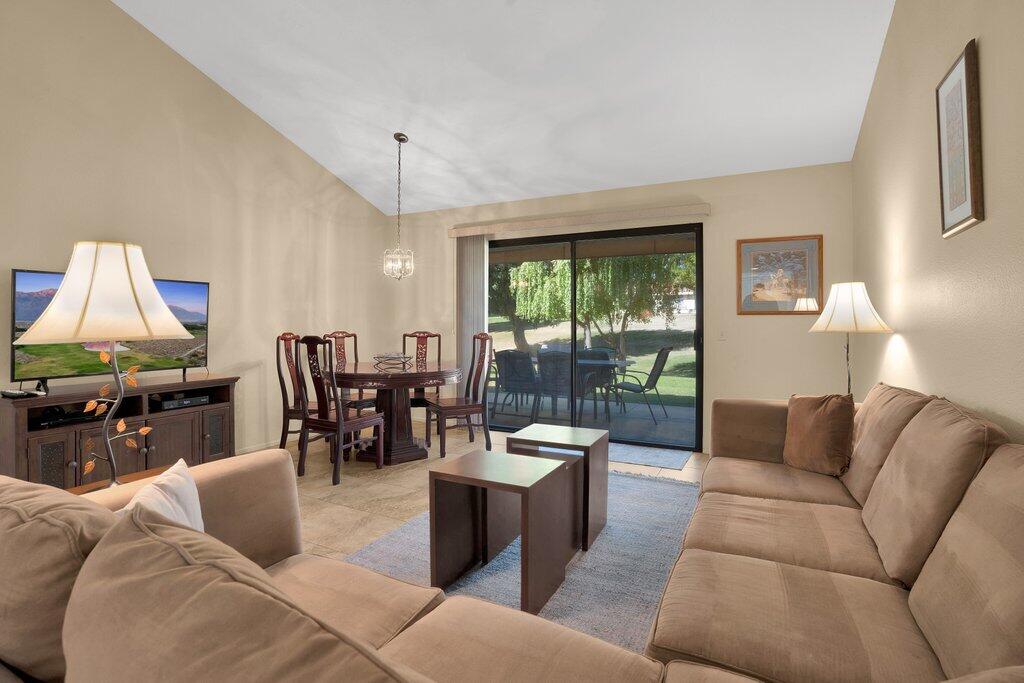 41071 Preston Trail Palm Desert, CA 92211 - Photo 4 of 29 a living room with furniture and a large window