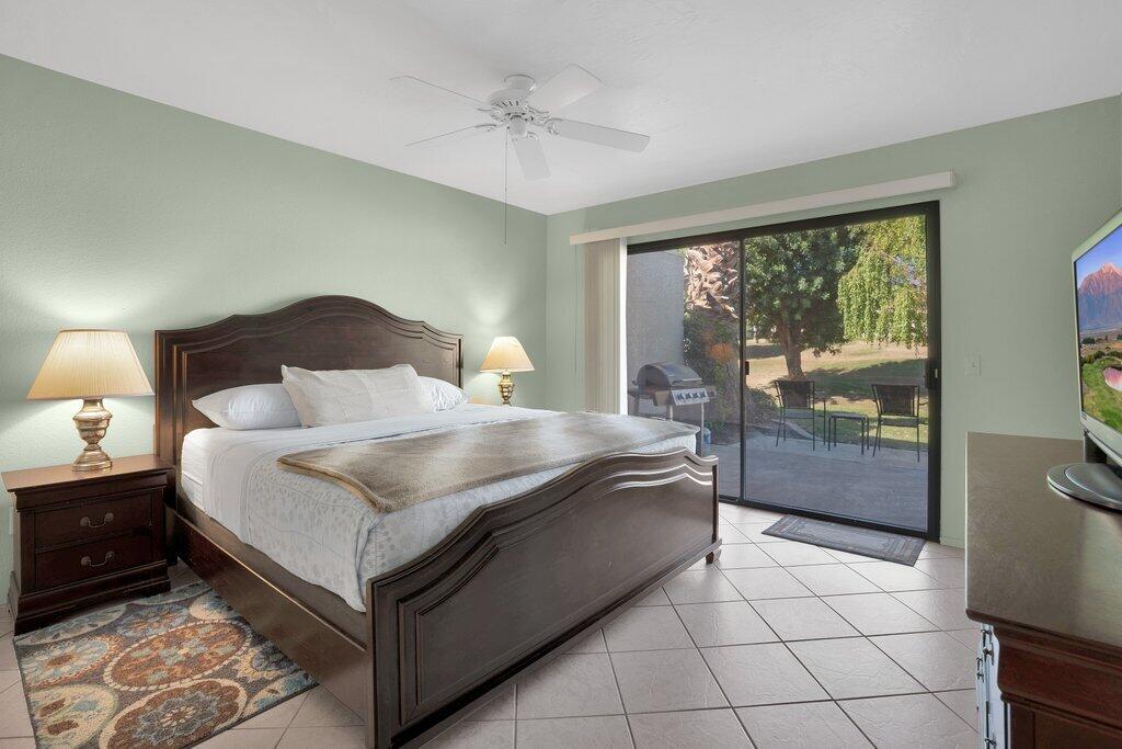 41071 Preston Trail Palm Desert, CA 92211 - Photo 9 of 29 a bedroom with a large bed and a view of bedroom