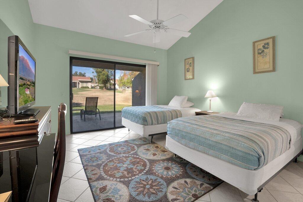 41071 Preston Trail Palm Desert, CA 92211 - Photo 10 of 29 a bedroom with two beds and a flat screen tv