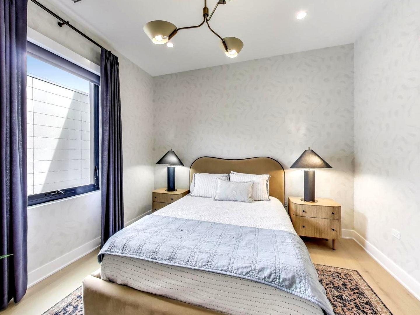 6 North Carpenter Street, Unit 5B Chicago, IL 60607 - Photo 20 of 40 a bedroom with a bed and a window