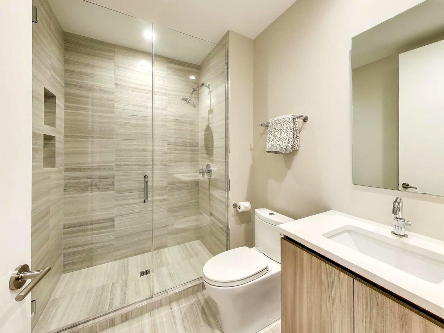 6 North Carpenter Street, Unit 5B Chicago, IL 60607 - Photo 27 of 40 a bathroom with a sink toilet and shower