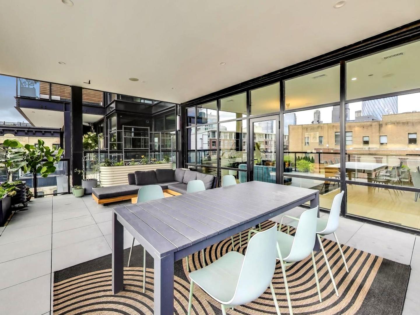 6 North Carpenter Street, Unit 5B Chicago, IL 60607 - Photo 35 of 40 a dining room with a table and chairs